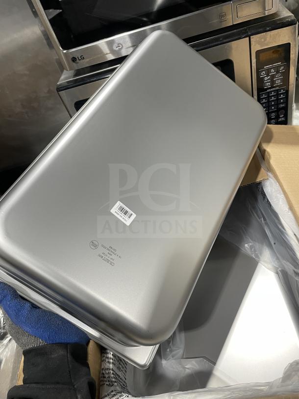 Brand new Crestware SAF-T-STAK stainless steel pan, full-size, 4" deep, anti-jam, with label and markings visible.