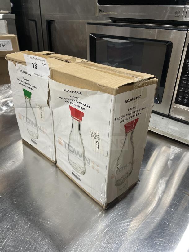 Town Commercial Food Service 6oz glass soy sauce bottles, dozen pack. New condition, red and green plastic tops. SN: 843784003849.