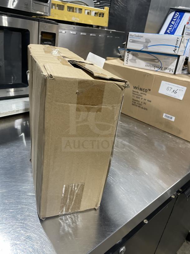 Cardboard box of Town 6oz glass soy sauce bottles, new, model SN: 843784003849, on a metal surface.