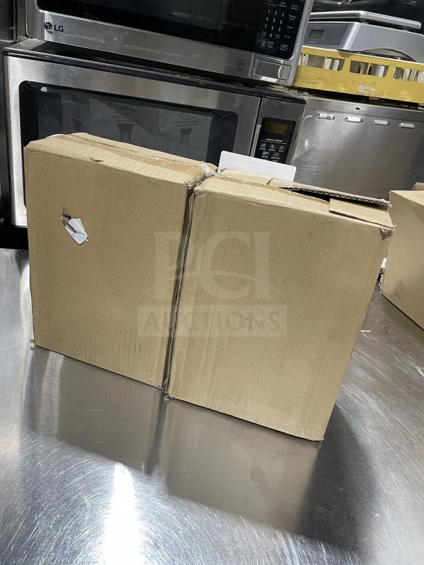 Two sealed cardboard boxes of Town Commercial 6oz Glass Soy Sauce Bottles on a stainless steel surface.