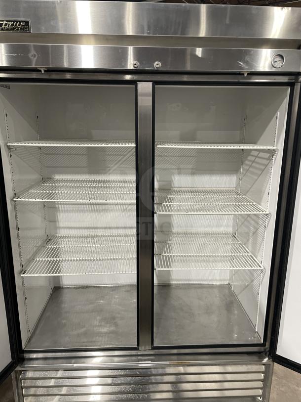 True T-49F 2-door stainless steel reach-in freezer, poly-coated racks, Energy Star Certified, serial 768945, 115V 1 Phase.