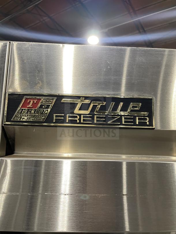 True T-49F commercial stainless steel 2-door freezer, Energy Star certified, with poly-coated racks, excellent condition.