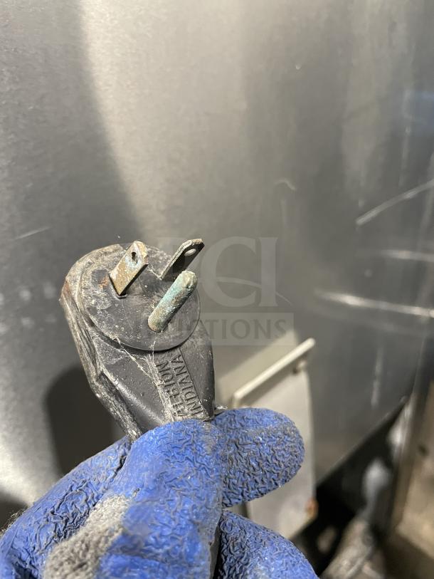 True T-49F commercial freezer, stainless steel, Energy Star, 2 doors, poly coated racks. Plug shown; 115V 1 Phase.