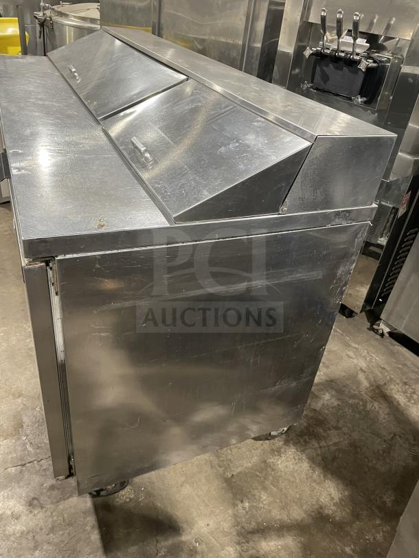 Beverage Air SPE72HC-18 stainless steel pizza prep table, 3-door, on casters, commercial grade, model SN: 12212304, 115V.