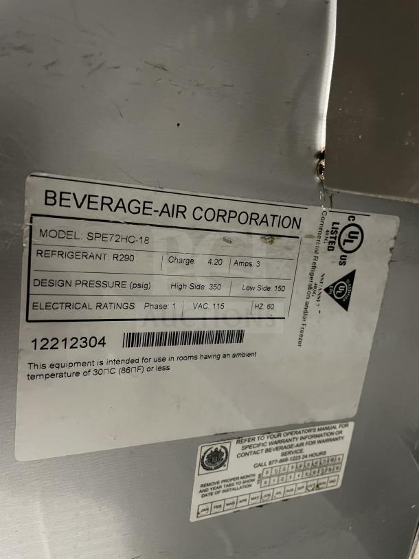 Beverage Air stainless steel pizza prep table, model SPE72HC-18, 3-door refrigerator on casters, 115V, good condition.