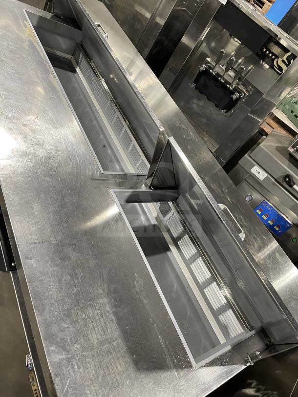 Beverage Air stainless steel 3-door pizza prep table, model SPE72HC-18, 115V, on casters, commercial grade.