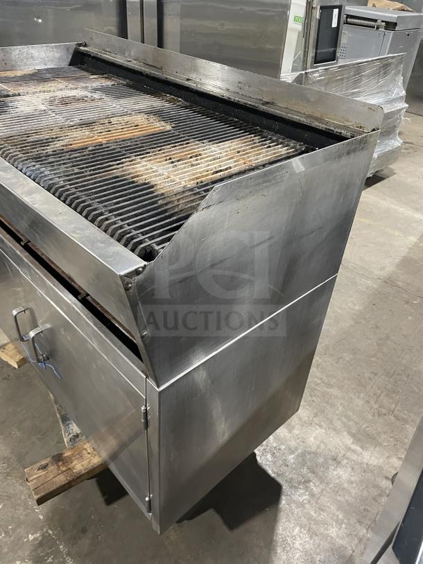 Rankin Delux stainless steel natural gas char broiler grill with back and side splashes, on legs; used condition.