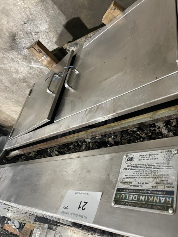 Rankin Delux stainless steel char broiler grill with back and side splashes, natural gas-powered, on legs, commercial-grade.