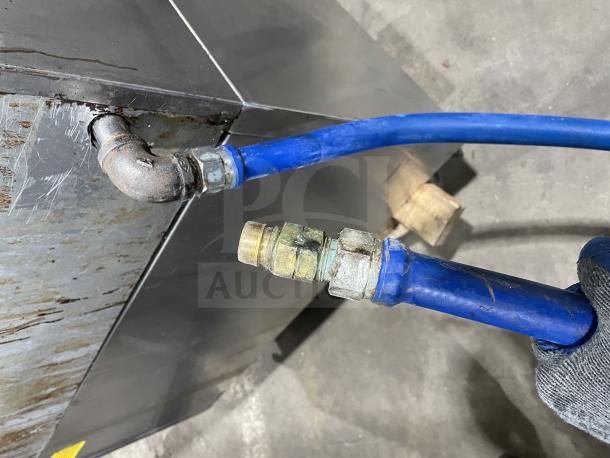 Rankin Delux stainless steel char broiler grill, natural gas-powered, with back and side splashes, on legs, fair condition.