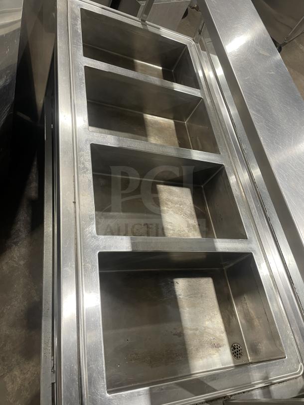 Atlas WIH-D&M-4 stainless steel steamtable with 4 wells, sneeze guard, tray slide, and dry cabinet. 208V, on casters.