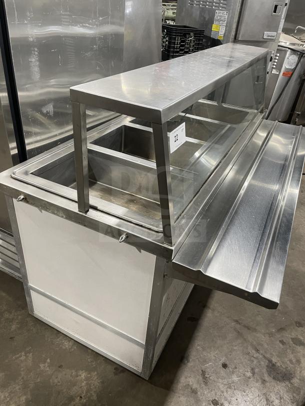 Atlas WIH-D&M-4 stainless steel electric 4-well steam table with sneeze guard, tray slide, and storage base on casters.