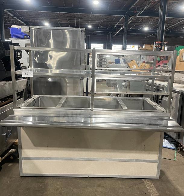 Alt text: Atlas Metal Industries stainless steel buffet-style hot food table, model WCM-BT-4, with sneeze guard, tray slide, and storage cabinet.