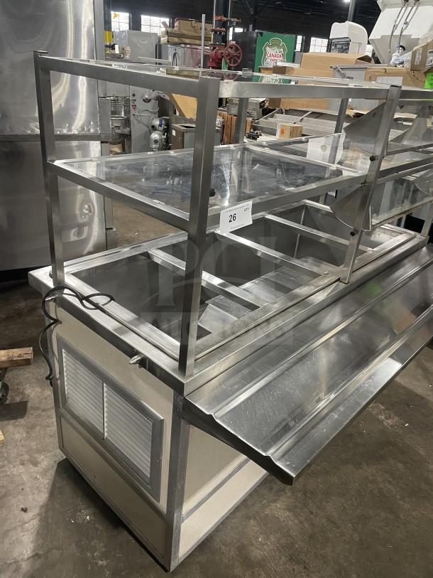 Atlas Metal Industries stainless steel hot food/steam table model WCM-BT-4. Features sneeze guard, tray slide, storage cabinet, and casters.