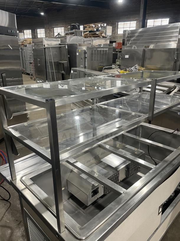 Atlas Metal Industries stainless steel 4-well hot food table, model WCM-BT-4, with sneeze guard and storage cabinet.
