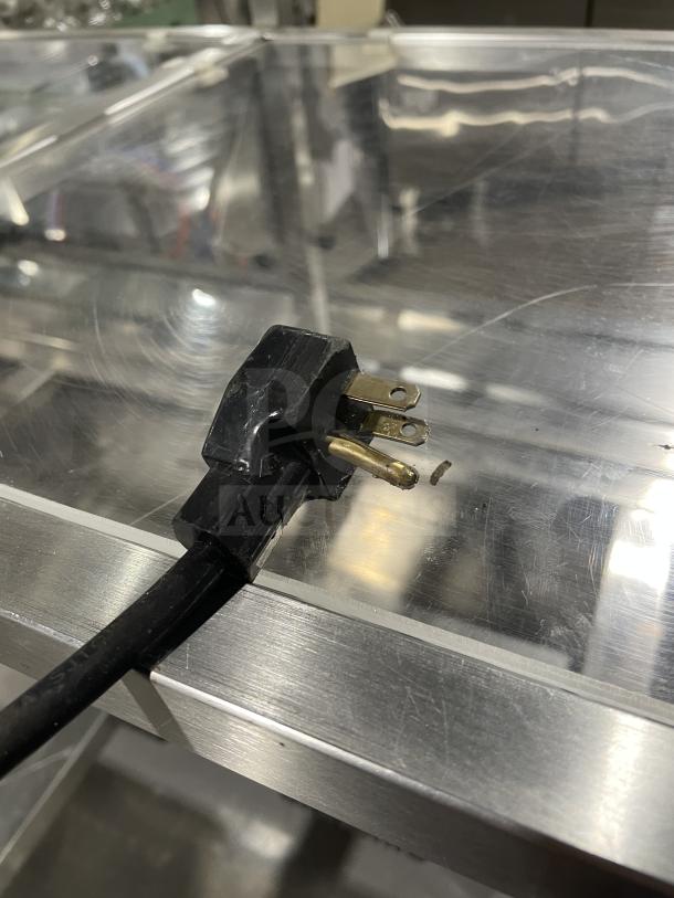 Atlas Metal Industries stainless steel hot food table plug, showing condition and three-prong design, Model WCM-BT-4.