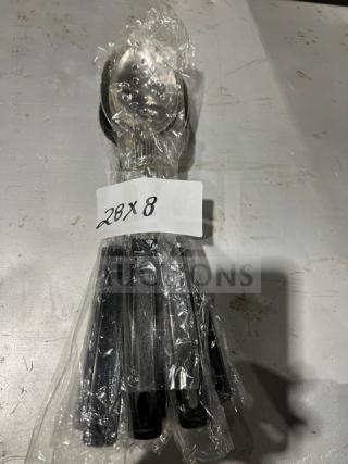 Vollrath 46946 stainless steel perforated spoodle, black grip handle, model 46946, wrapped with "20X8" label.