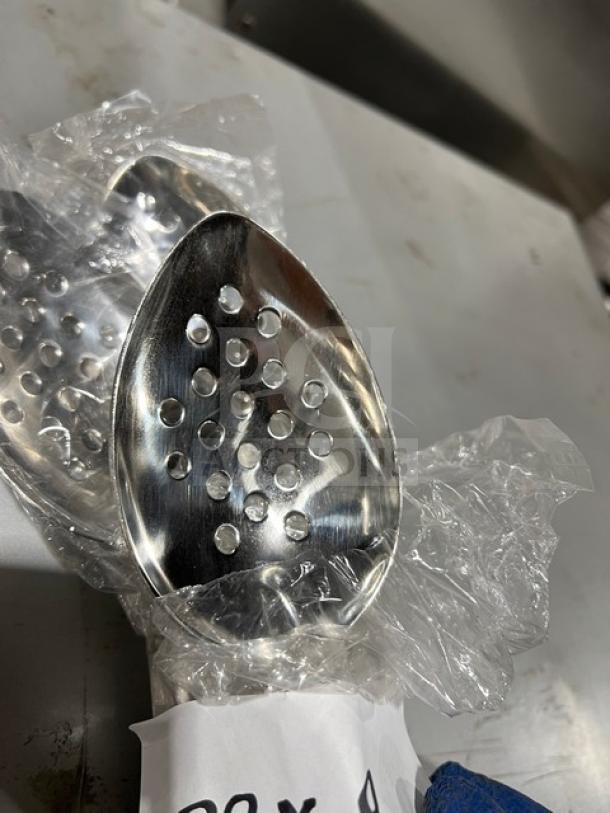 Vollrath 46946 commercial perforated stainless steel spoodle with black grip handle, in good condition.