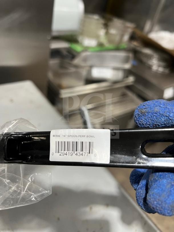 Vollrath Model 46946 14" stainless steel perforated spoodle with black grip handle, shown with label indicating model and barcode.