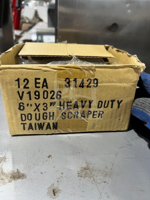BRAND NEW Jimmy John's style stainless steel dough scraper with white grip handle. Box marked "6''x3'' heavy duty dough scraper Taiwan."