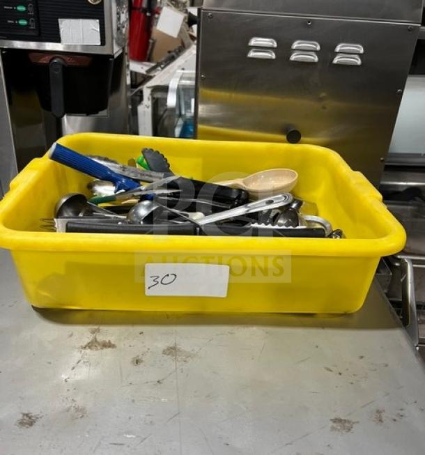 Yellow bin with Winco TR34W kitchen tools, including spoons and tongs, used condition, labeled "30."