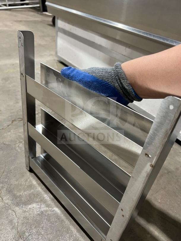 Commercial side smoker/refrigeration rack, stainless steel, sturdy design, excellent condition, shown with blue glove for size reference.