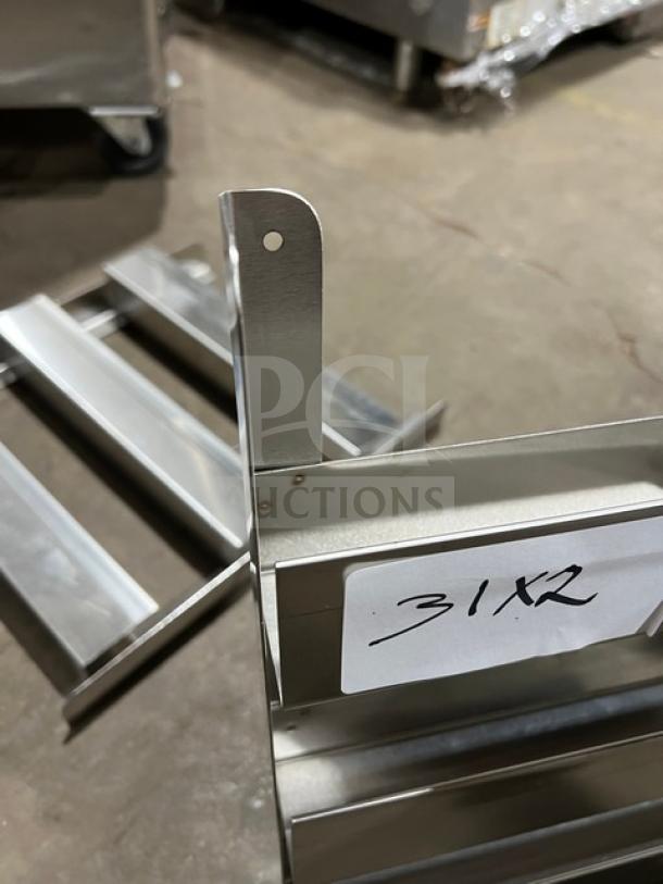 Commercial side smoker racks in stainless steel, pristine condition, labeled "31X2." Ideal for kitchens or catering.