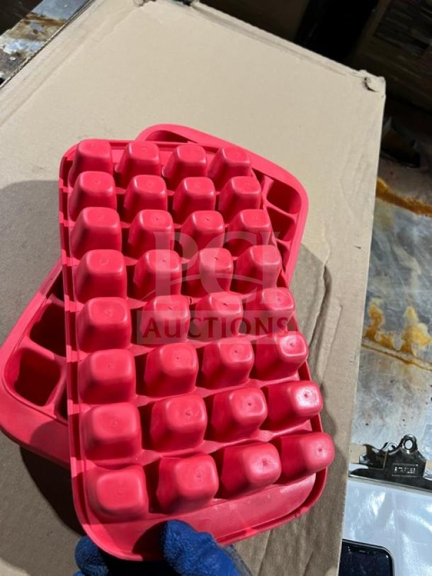Lekue commercial silicone ice cube tray in red, gently used condition, features multiple cube compartments.