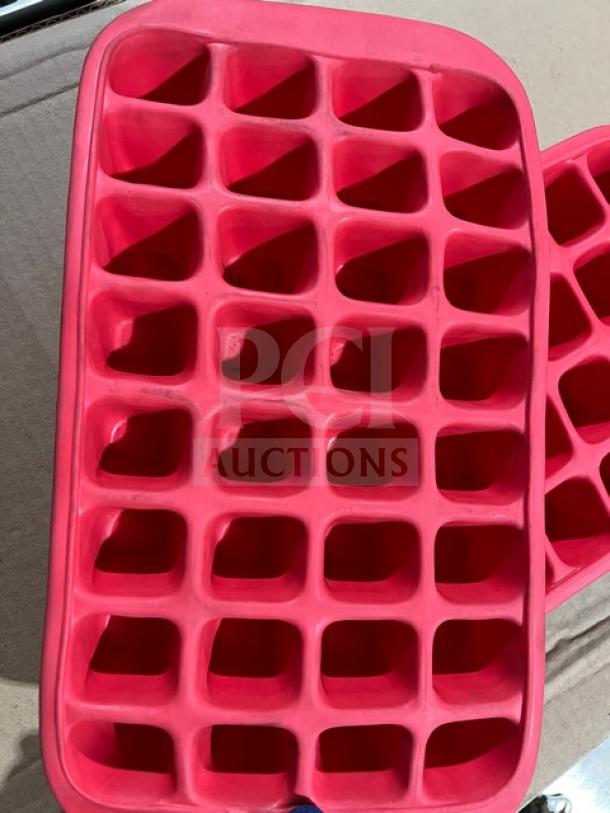 Red Lekue commercial silicone ice cube tray, featuring multiple square molds. Durable, flexible design. Excellent condition.