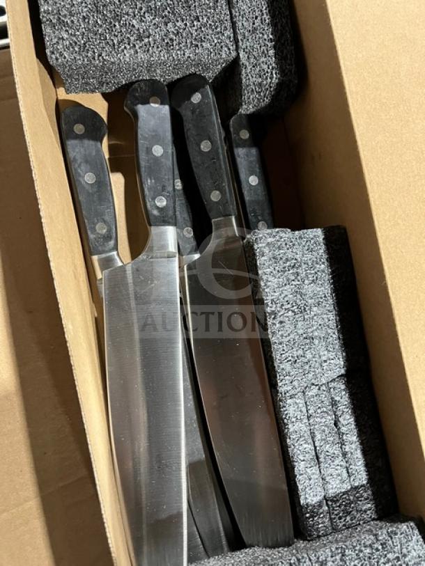 Brand new Dexter commercial stainless steel knives with black grip handles, packaged in protective foam in a cardboard box.
