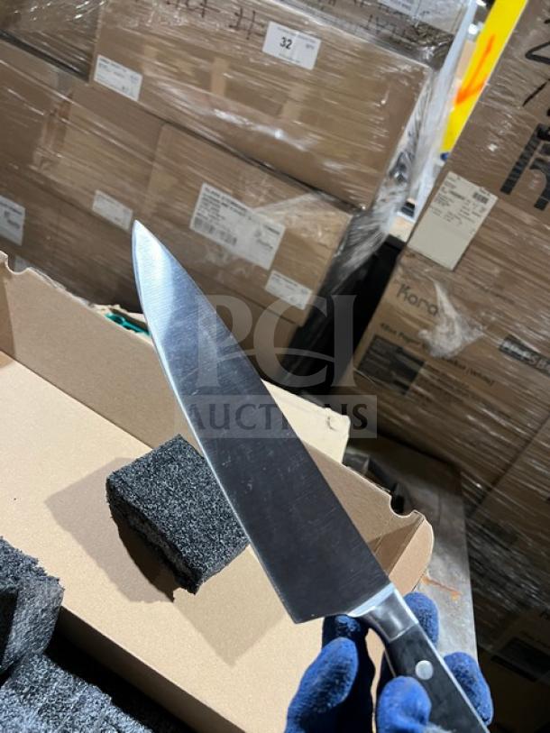 Brand new Dexter commercial stainless steel knife with black grip handle, unpacked condition, ideal for professional use.