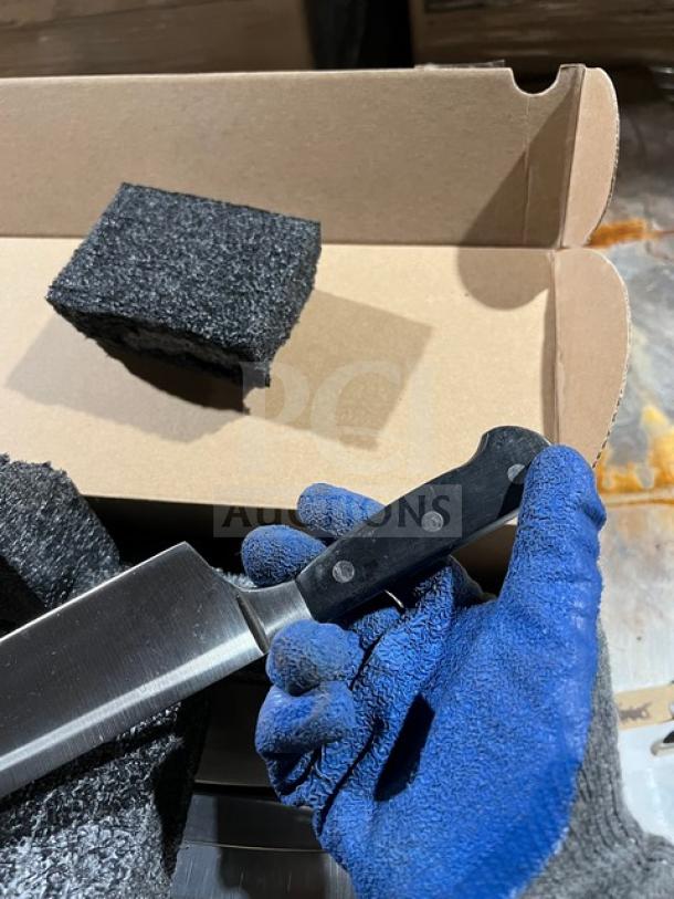 Brand new Dexter commercial stainless steel knife with black grip handle, shown in original packaging.