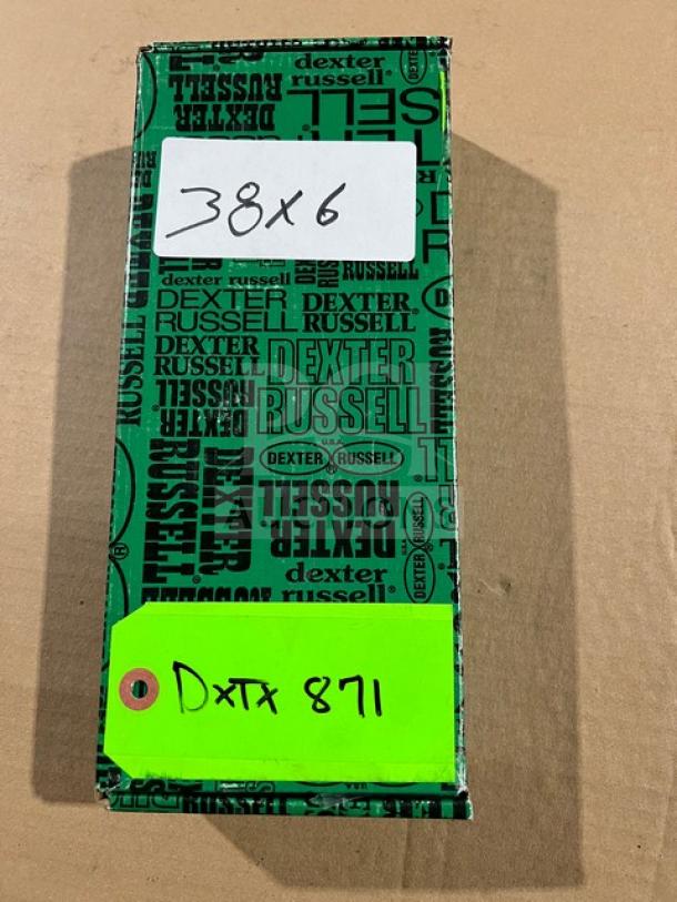 Dexter Russell S254 offset spatula in box. Features stainless steel blade and orange grip handle. Box marked "38x6" and "Dxta 871".