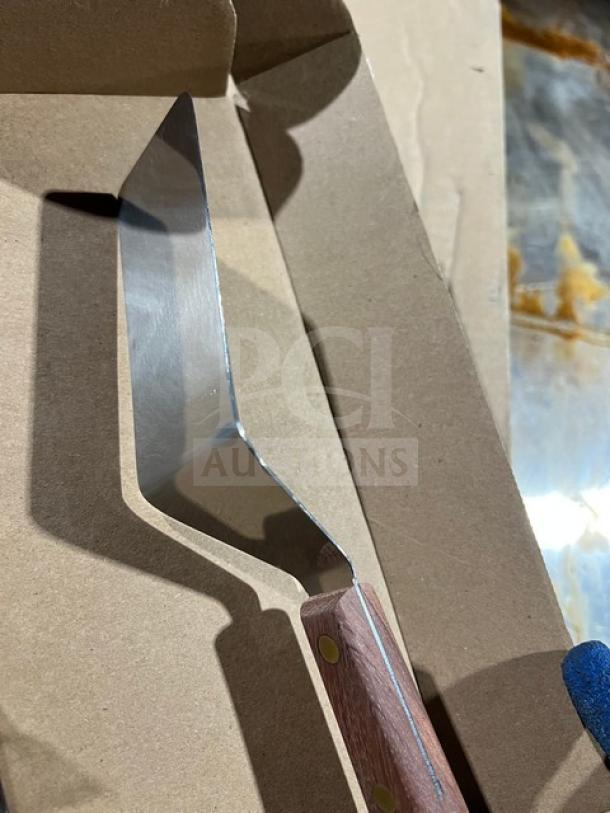 Dexter Russell S254 stainless steel offset spatula with orange grip handle, new condition, commercial quality.