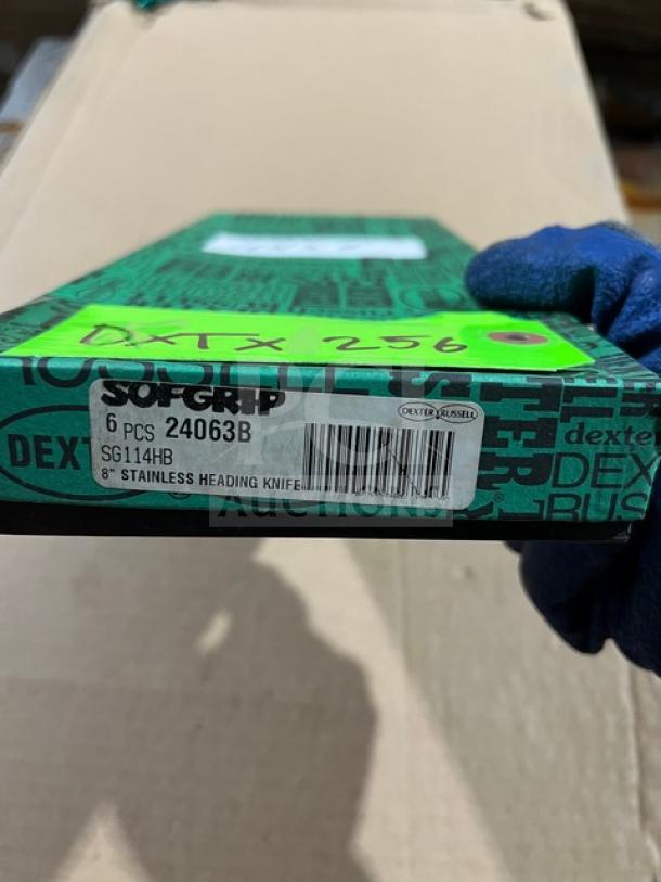 Box for Dexter Russell S104B-PCP knife. Labeled "Soft Grip" and "Dexter Russell 8" stainless heading knife," with product codes.