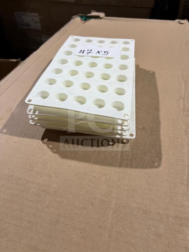 White commercial plastic vial rack, 35 wells, stackable, in excellent condition. Note with "5X" visible on top.