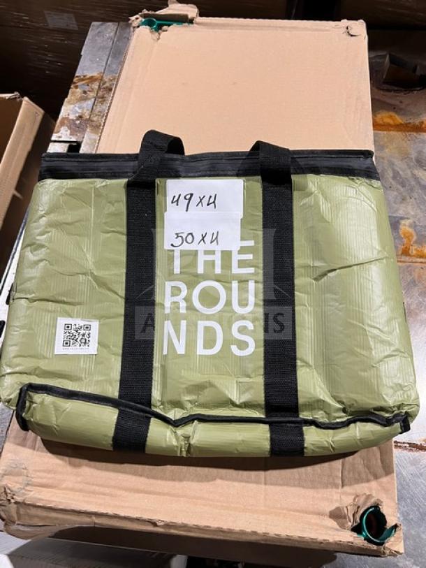 Reusable green delivery bag by The Rounds, commercial use, features black straps, includes QR code and size markings.