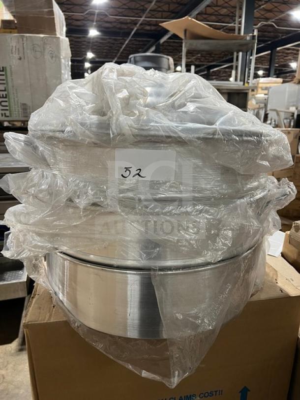 New commercial stainless steel 3-tier food steamer, wrapped in plastic, excellent condition. Label reads "52".