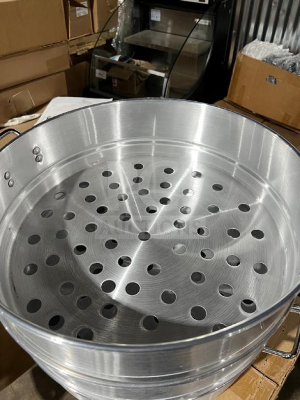New commercial stainless steel food steamer with three tiers, featuring a perforated design. In excellent condition.