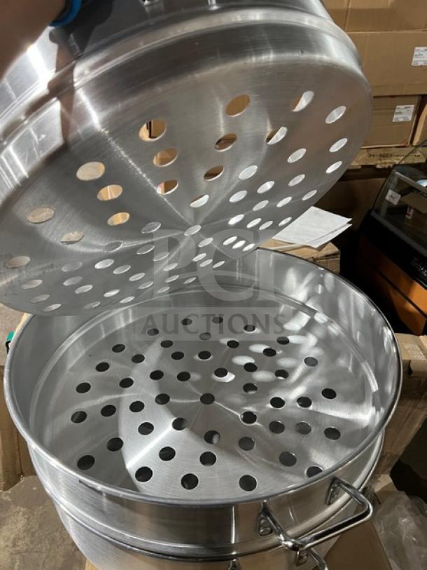 New commercial stainless steel food steamer with three tiers, perforated design, new condition, sturdy and durable.