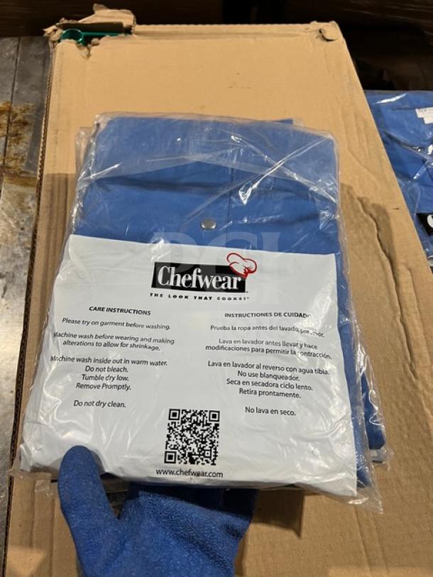 Brand new Chefwear model 4931 blue bar jacket, 5X size, in packaging. Polyester/cotton blend, single-breasted style.