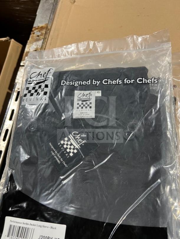 Chef Revival black poly/cotton chef jacket, XS size, model J200BK-XS, new in packaging with labels shown.