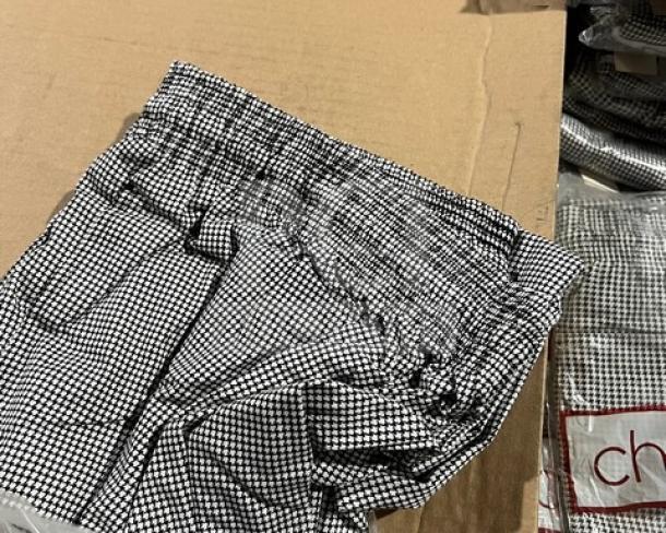 Brand new Chefwear Model 3200-11-4X cargo style chef pants in 4X size, black and white checkered pattern.