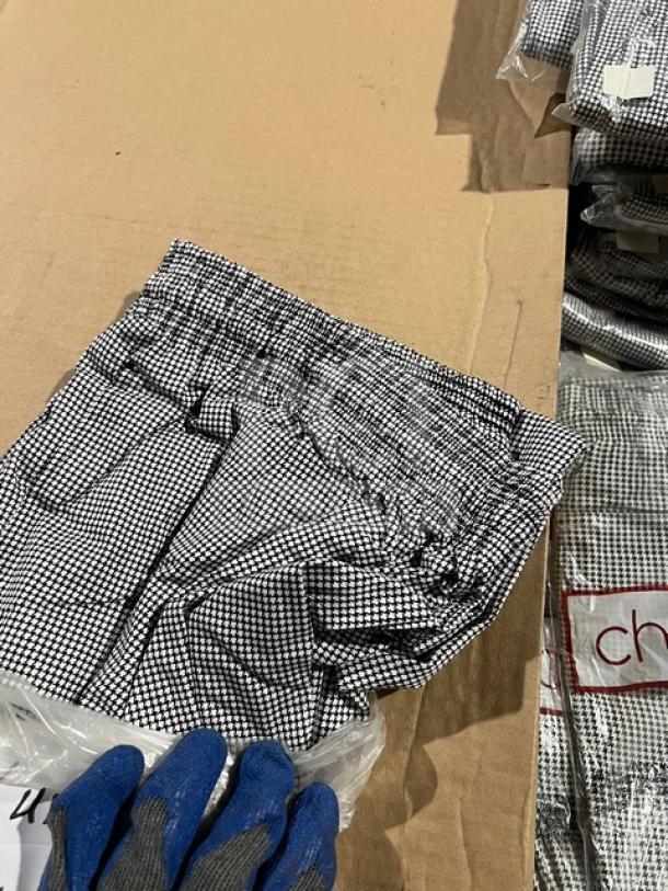 Brand new Chefwear CW3200 cargo chef pants, size L, black and white check pattern, elastic waist, in packaging.