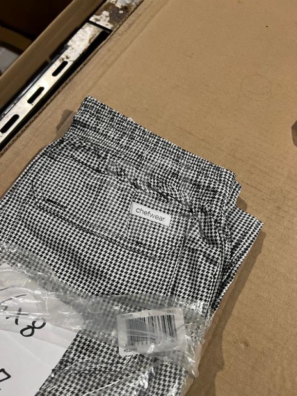 Brand new Chefwear CW3200 cargo style chef pants, size L, black and white checkered pattern, in original packaging.