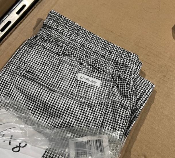 Brand new Chefwear CW3200 cargo style chef pants, size large, black and white checkered pattern, in original packaging.