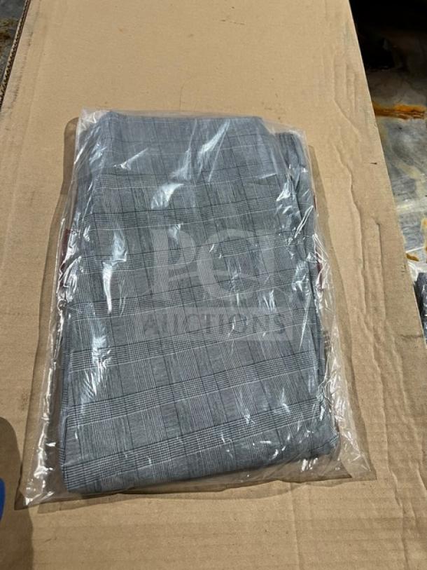 Brand new Chefwear CW3640 XL cargo chef pants in package; plaid pattern, perfect condition, ideal for commercial use.