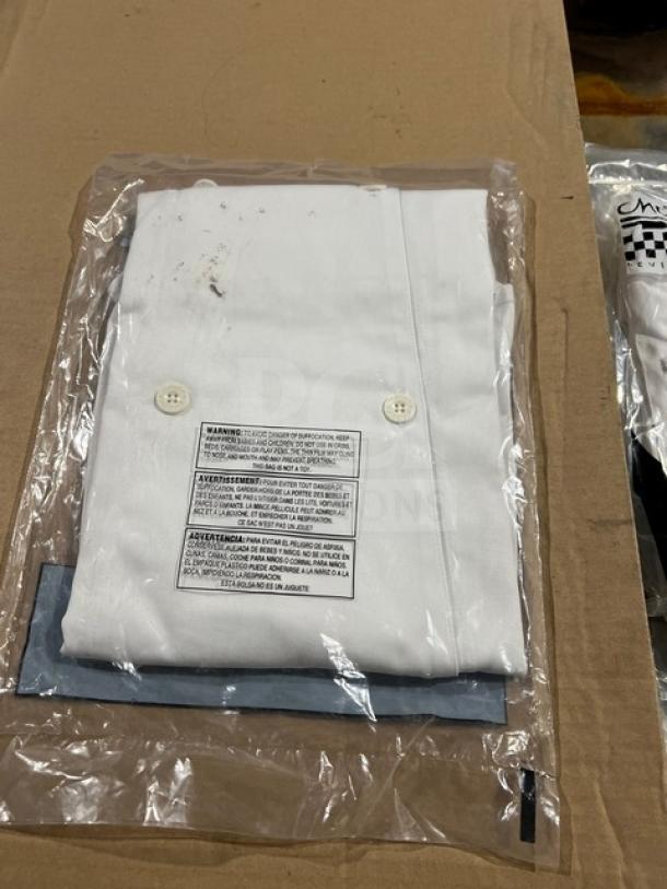 NEW Chef Revival white polyester/cotton blend chef jacket, size S, model LJ027-S, in packaging with care labels visible.