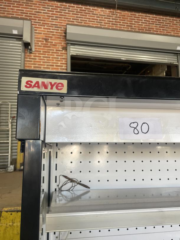 Sanye black multi-tier refrigerated merchandiser display case, open front, ideal for grab-n-go, sturdy condition, labeled "Sanye."