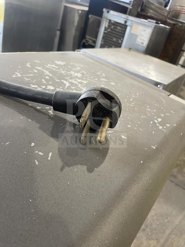 TurboChef NGO rapid cook oven plug, showing wear. Model NGOD06282. For commercial use, 208/240V, 1 phase.