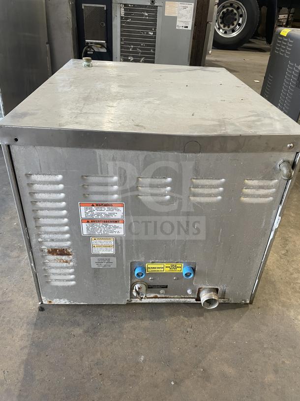 Vulcan C24EA3 stainless steel 3-pan convection steamer, electric, countertop model. Features pan rack, visible markings.